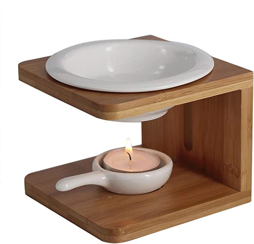Ember & Co ceramic essential oil burner with white dish on bamboo frame