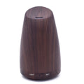 Ember & Co aromatherapy oil diffuser in dark woodgrain finish with light and mist controls