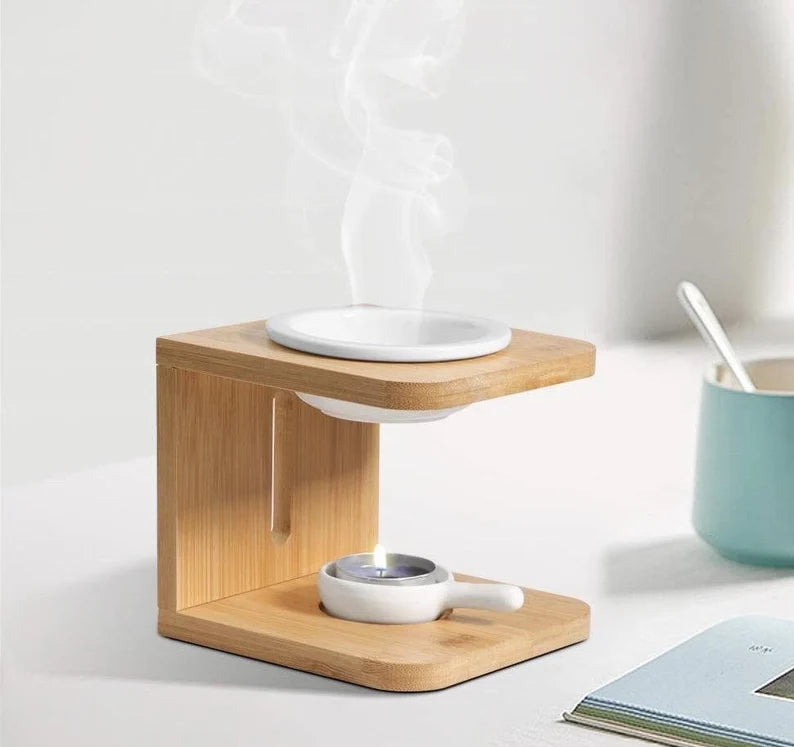 Ember & Co ceramic oil burner detail showing white dish and natural bamboo