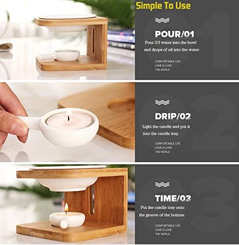 Ember & Co tea light oil burner styled on a wood surface, warm glow