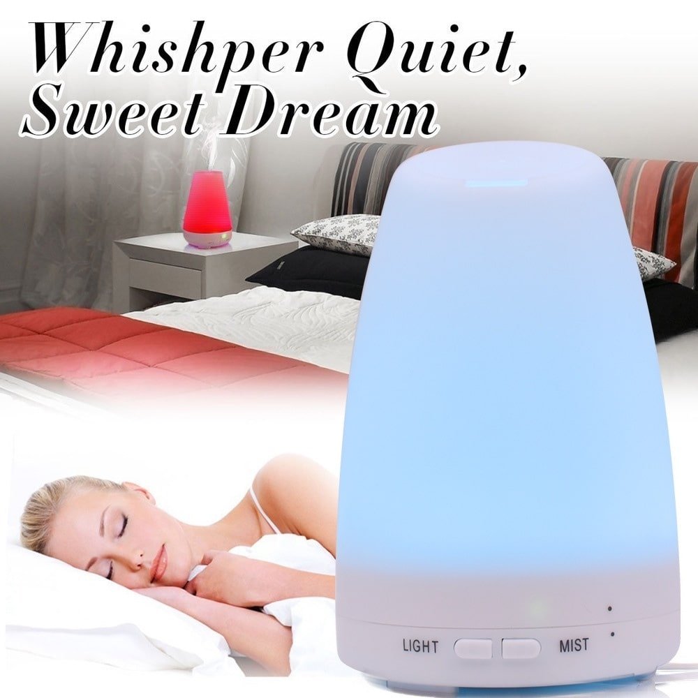 Ember & Co aromatherapy diffuser styled in a cozy bedroom corner