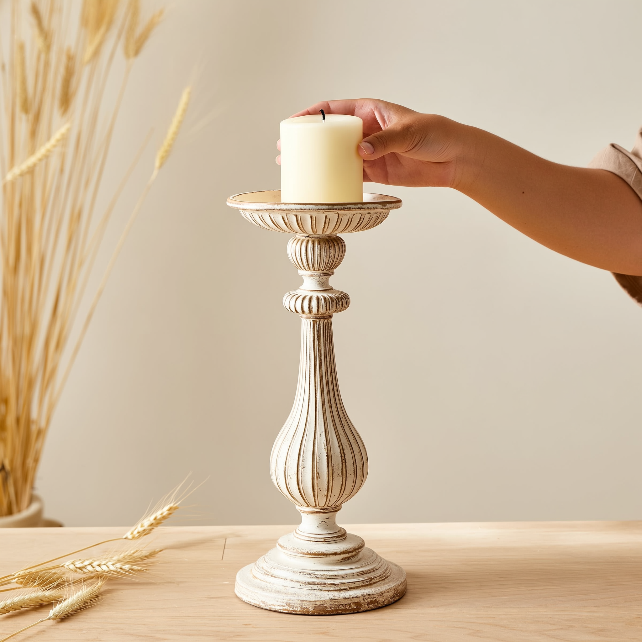 Ember & Co Vintage Pillar Candle Holder styled with dried wheat, hand placing pillar candle